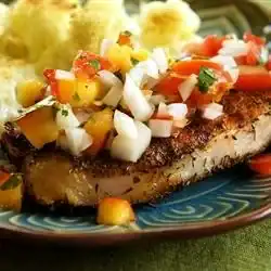 pork chops with salsa on top
